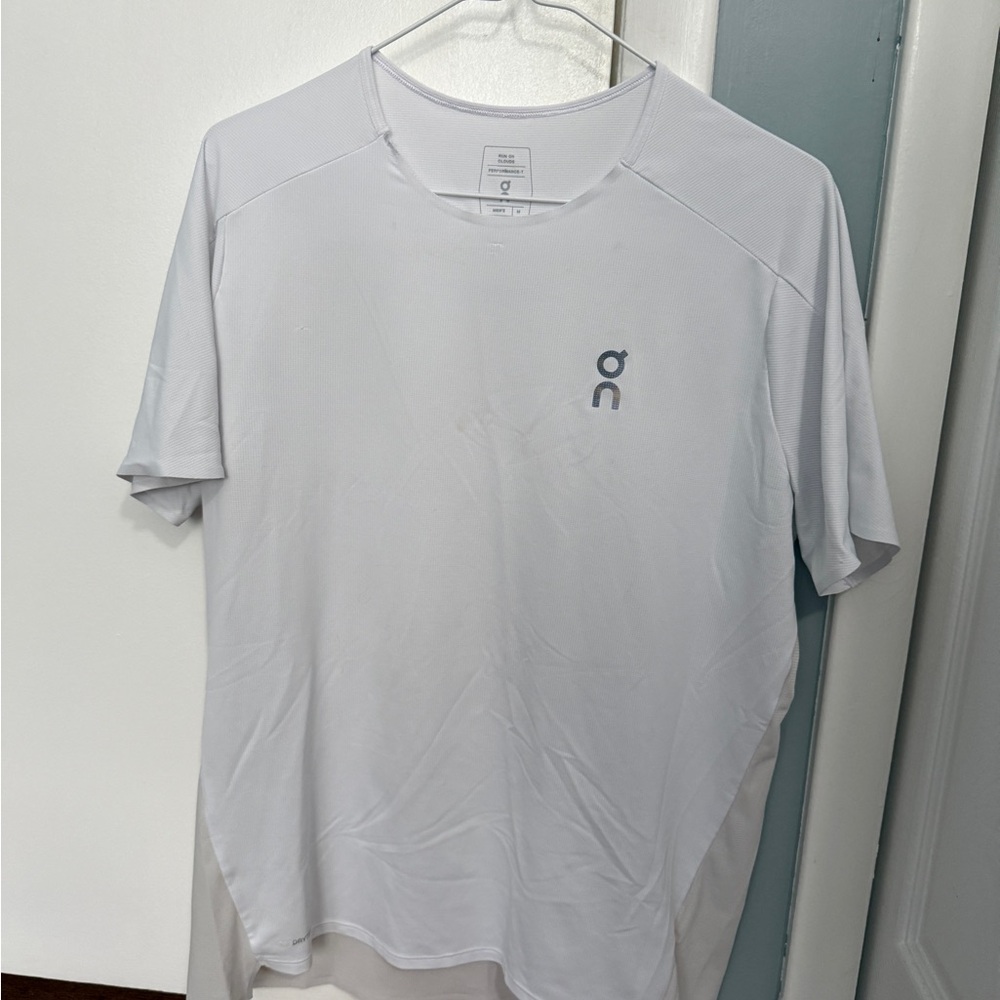 On Running Men's Performance Tee - good condition, but minor damage on collar